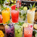 Elegant baby shower mocktail drink station with colorful non alcoholic drinks